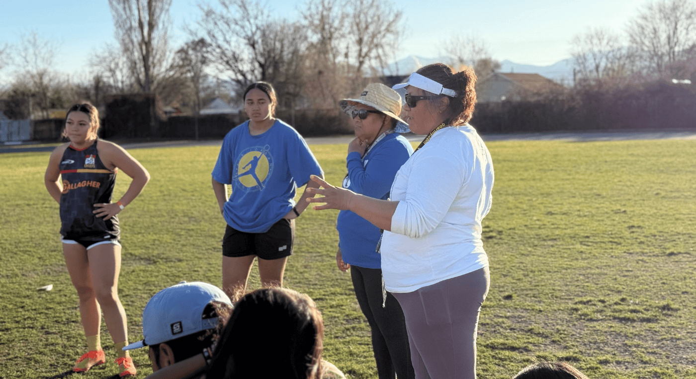 Glendale Women's Rugby Coaches talking to players on the field